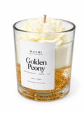 Vela HATHI Golden Peony de frente, com peónia branca e base dourada
